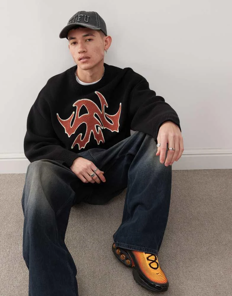 Weekday Weekday Cypher oversized jumper with red jacquard graphic in black 1