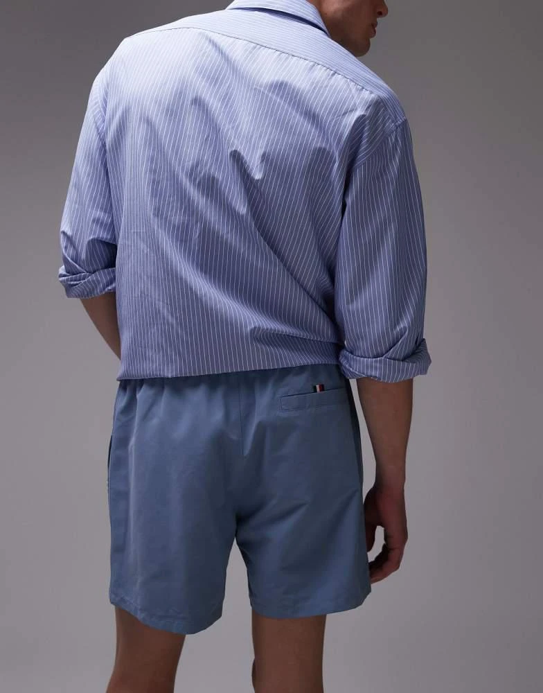 Tommy Hilfiger Tommy Hilfiger drawstring flag taping swim shorts in blue 3