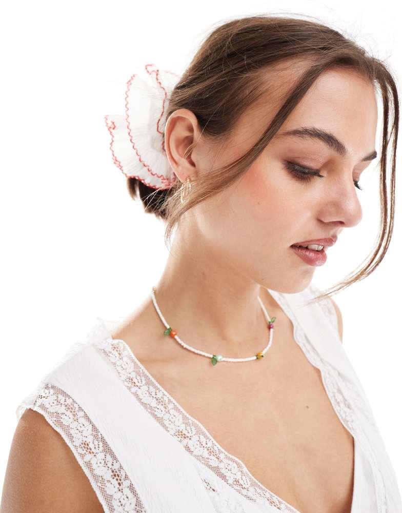 ASOS ASOS DESIGN scrunchie with plisse detail in white with red edges