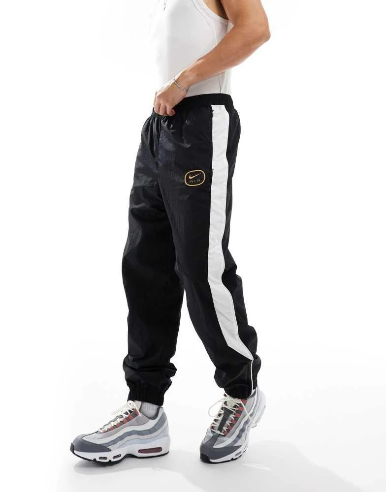 NIKE Nike Swoosh Air woven joggers in black and white 4