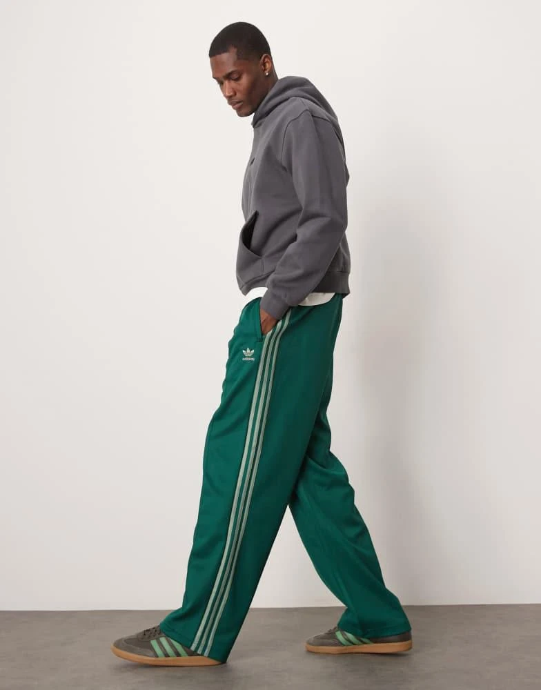 Adidas adidas Originals Firebird Loose track pants in green 1