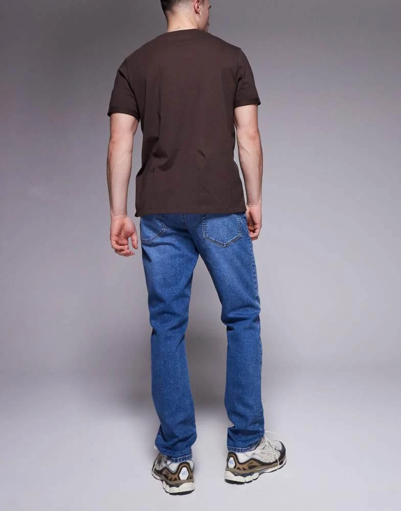 ASOS ASOS DESIGN slim fit jean in mid wash blue 2