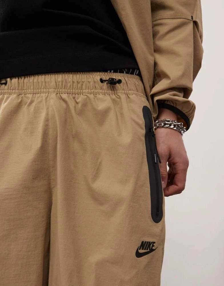 NIKE Nike Tech woven trouser in beige 4