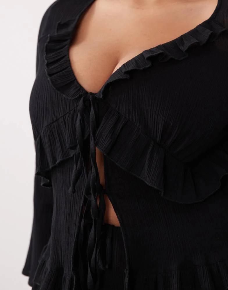 Esmee Curve Esmee Curve tie front ruffle trim beach top in black 3