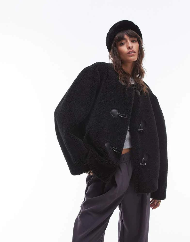 Topshop Topshop toggle short collarless borg coat in black 1
