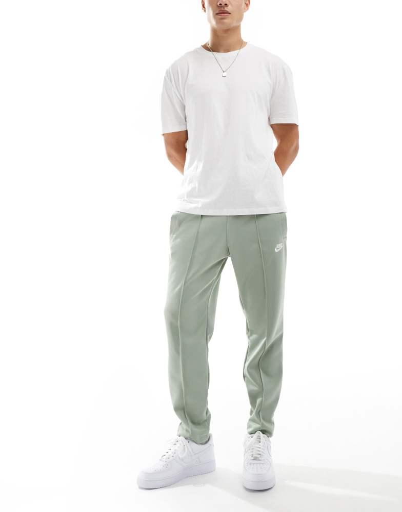 Olive green nike track pants best sale