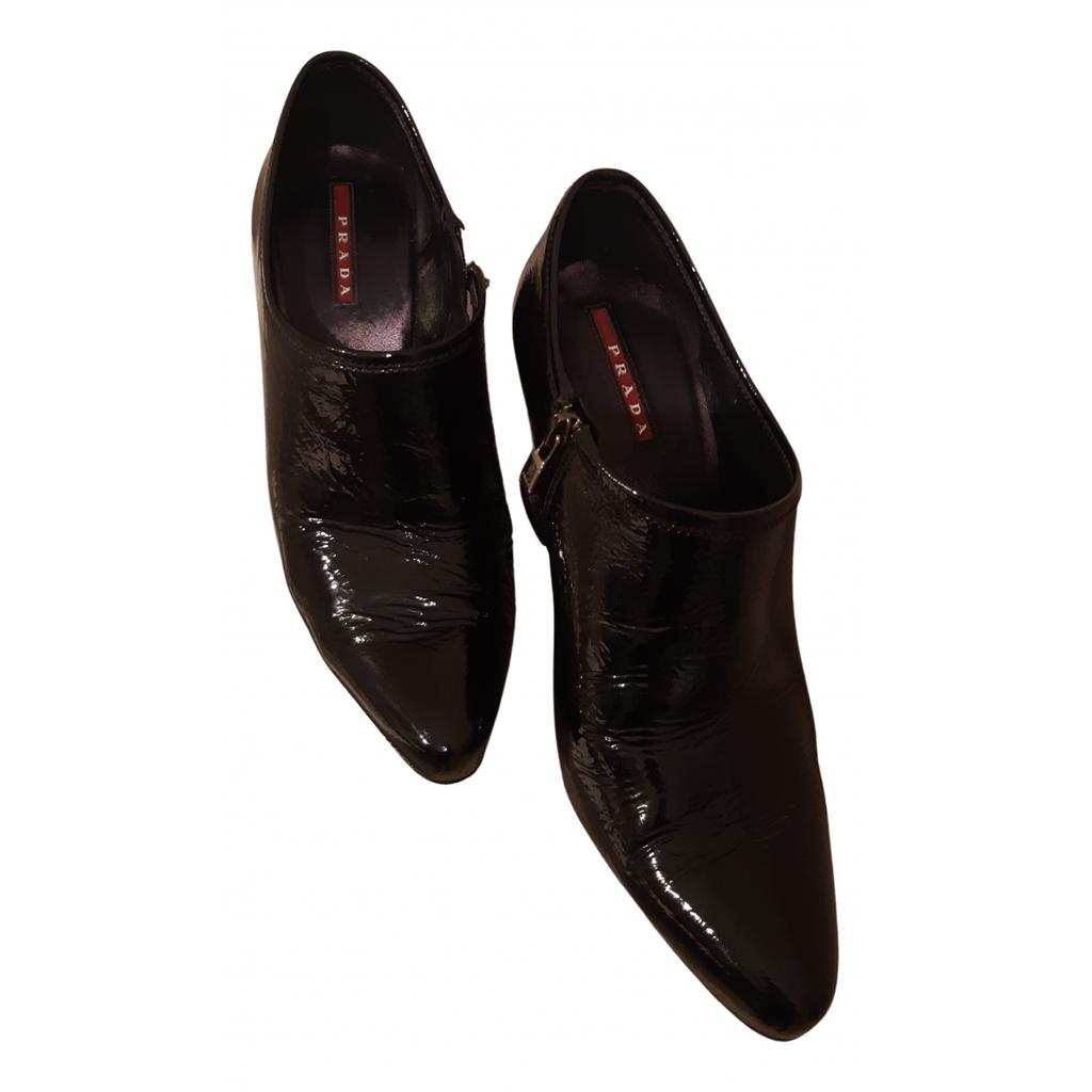 Prada Prada Patent leather buckled boots