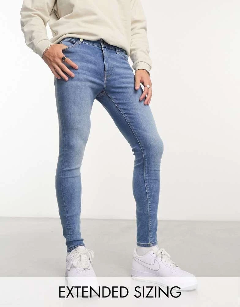 ASOS ASOS DESIGN power stretch jeans in mid wash blue 1