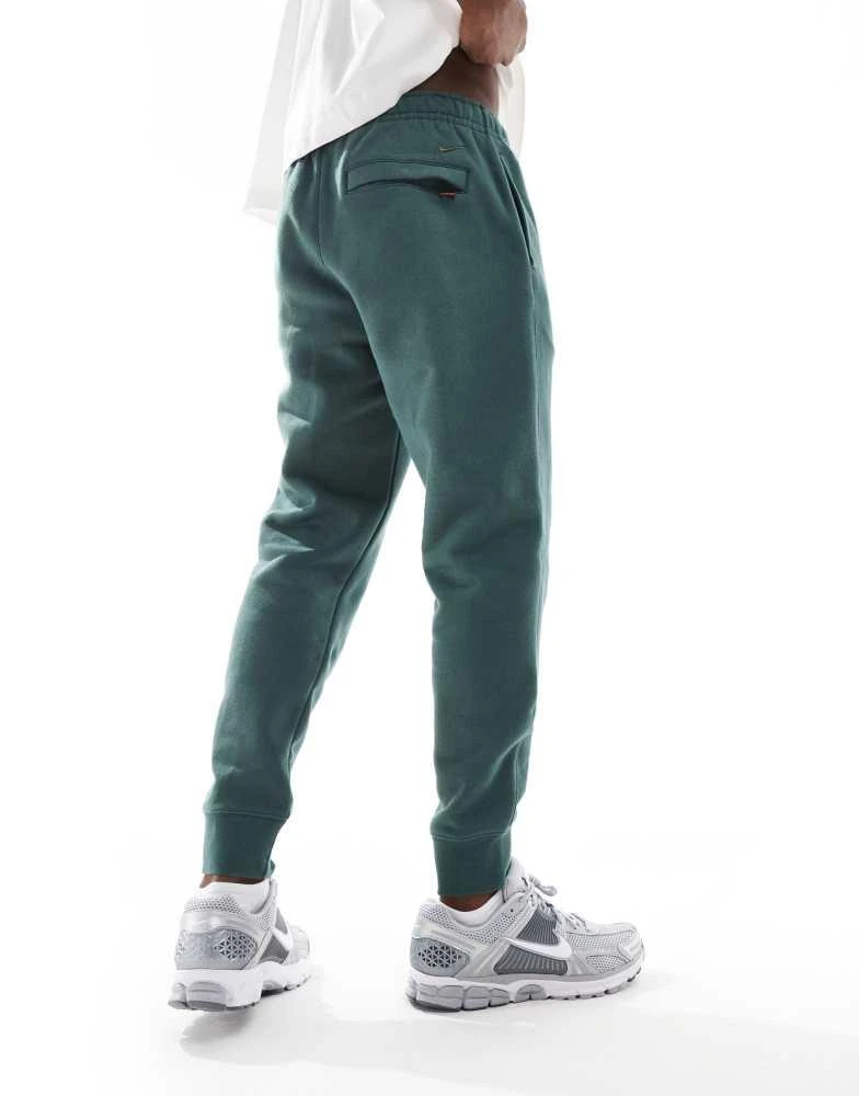 NIKE Nike Club festive joggers in dark green 4