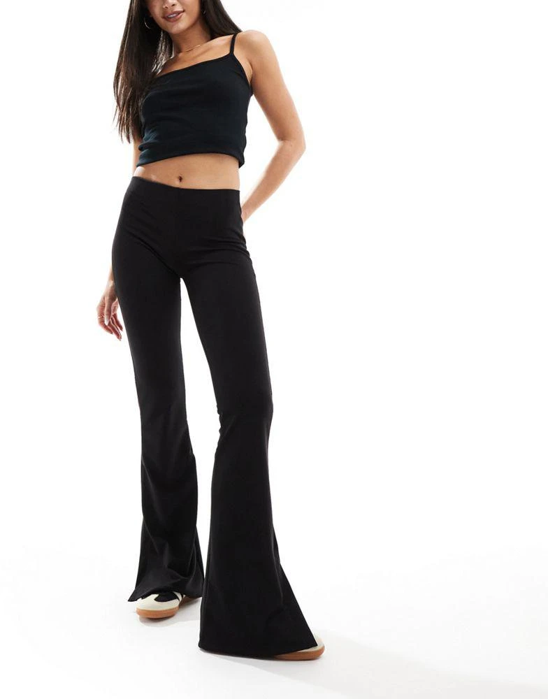 Bershka Bershka high waisted jersey flared trousers in black 1