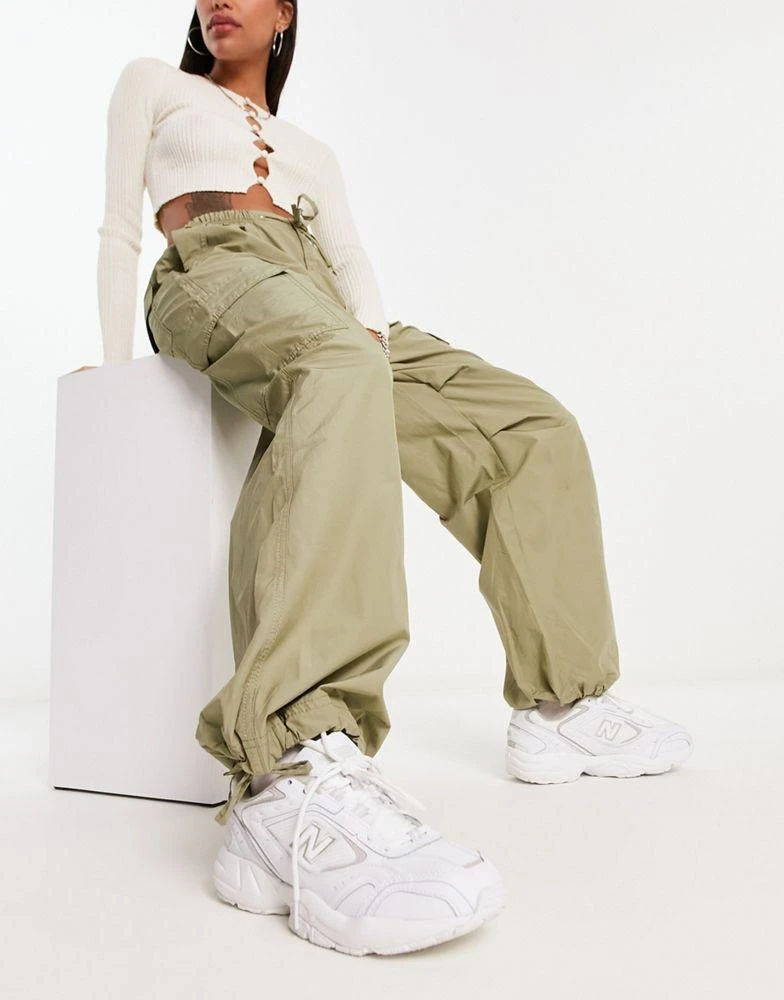 Bershka Bershka tie waist nylon cargo parachute trousers in khaki 1