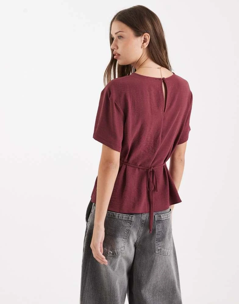 Shop ASOS DESIGN tie back cinch detail woven tee in Mulberry on