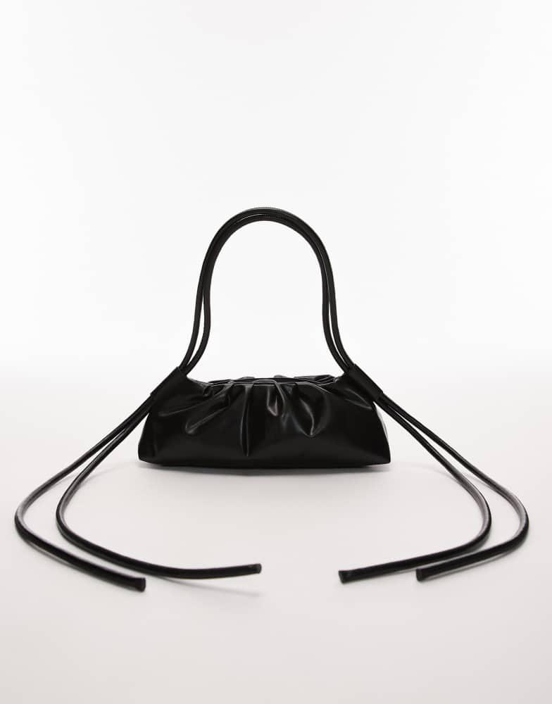 Olend OLEND dumpling leather elongated shoulder bag in black