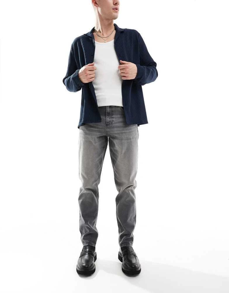 ASOS ASOS DESIGN tapered fit jeans in washed black 1