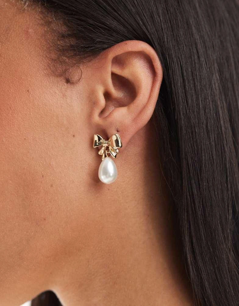 ASOS ASOS DESIGN earrings with mini bow and faux pearl drop design on gold tone 2