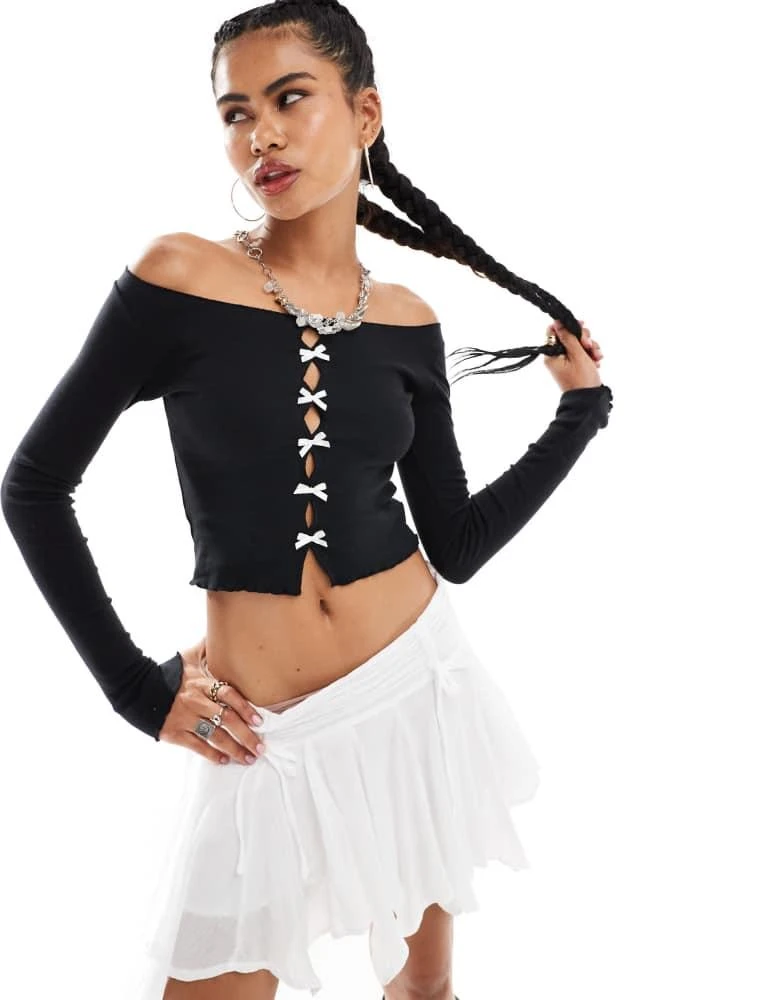 minga Minga London cutout long sleeve top with bows in black 1
