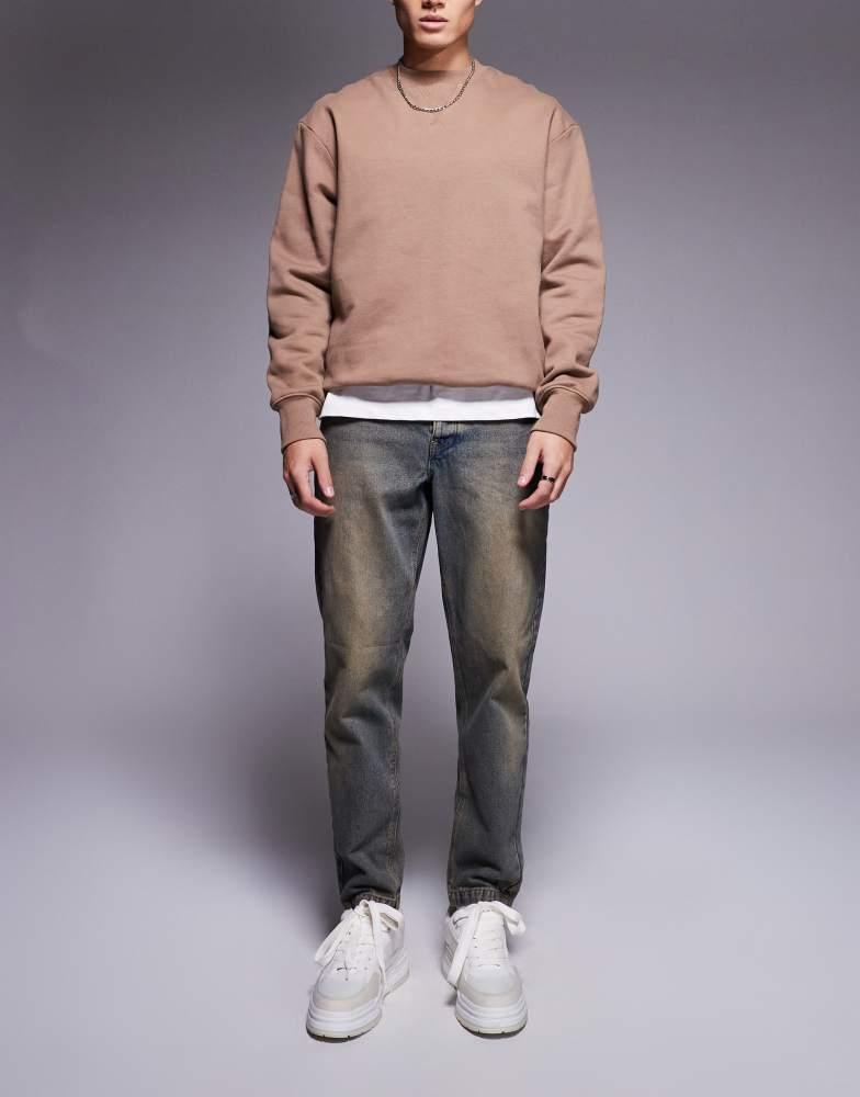 ASOS ASOS DESIGN tapered fit jean in light wash with tint