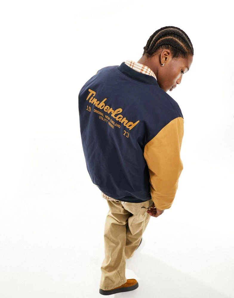 Timberland Timberland utility varsity bomber jacket with back print in navy with contrast sleeves 1