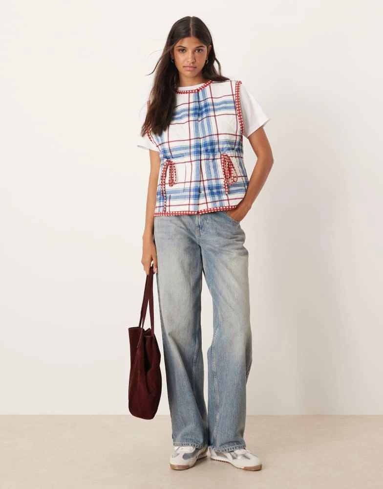 ASOS ASOS DESIGN gilet with check quilted design and bow pocket detail in blue 3