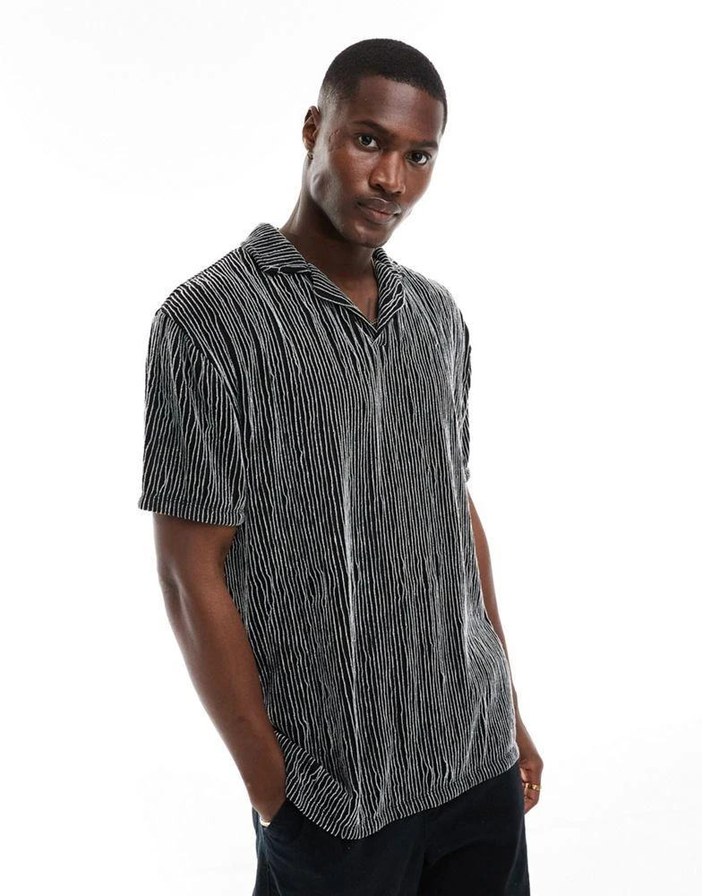 ASOS ASOS DESIGN relaxed revere polo in black textured stripe 4