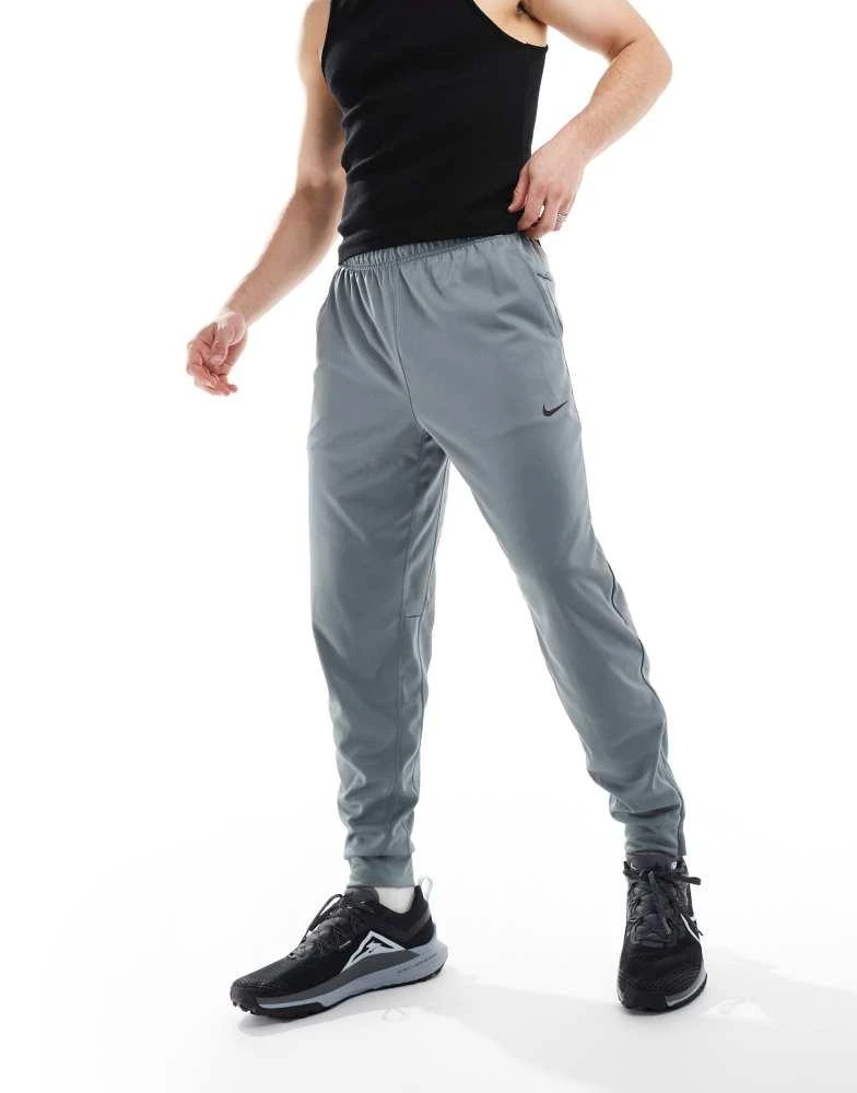 NIKE Nike Training Totality Dri-FIT tapered joggers in grey 1