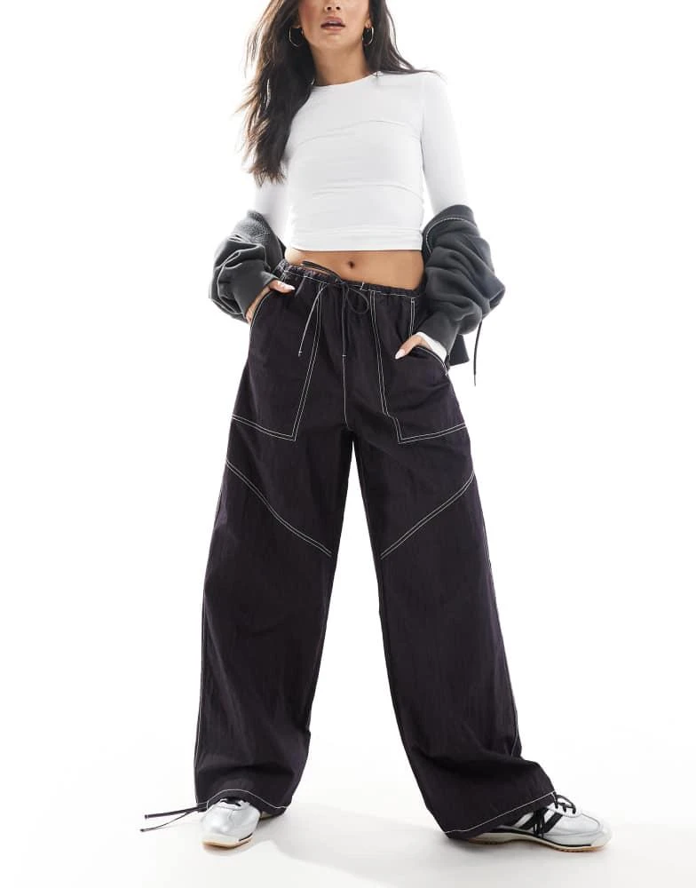 ASOS ASOS DESIGN wide leg trouser with tie hem and pocket detail in navy crinkle 1