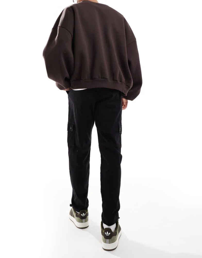 ASOS ASOS DESIGN tapered cargo trouser in black 2