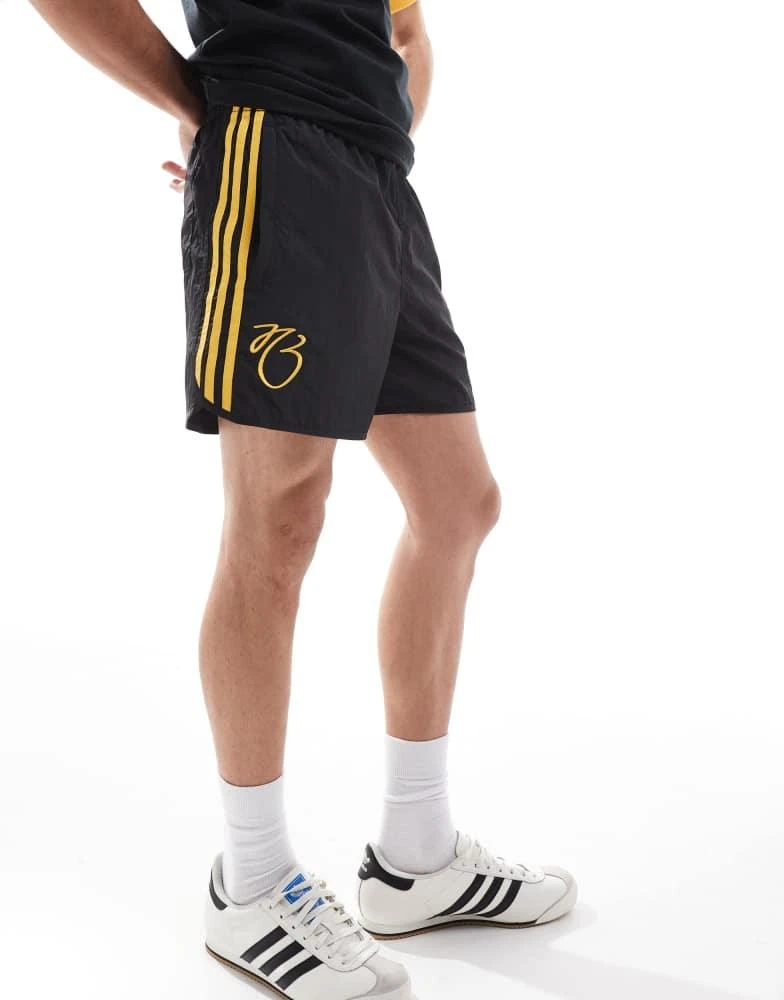 Adidas adidas Originals Jude Bellingham shorts in black and gold 1