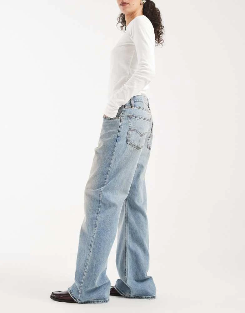 Levi
s Levi
s loose bootcut jeans in yellow tint mid blue 3