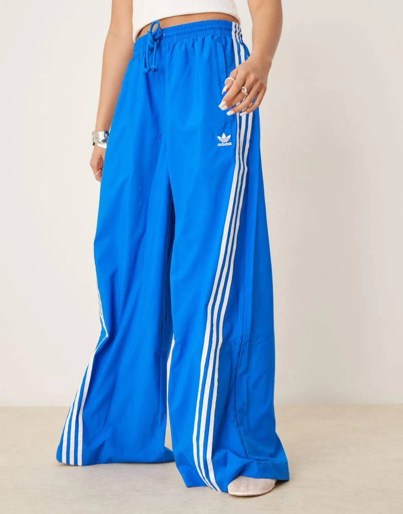 Adidas adidas Originals three stripe oversized track pants in blue 2