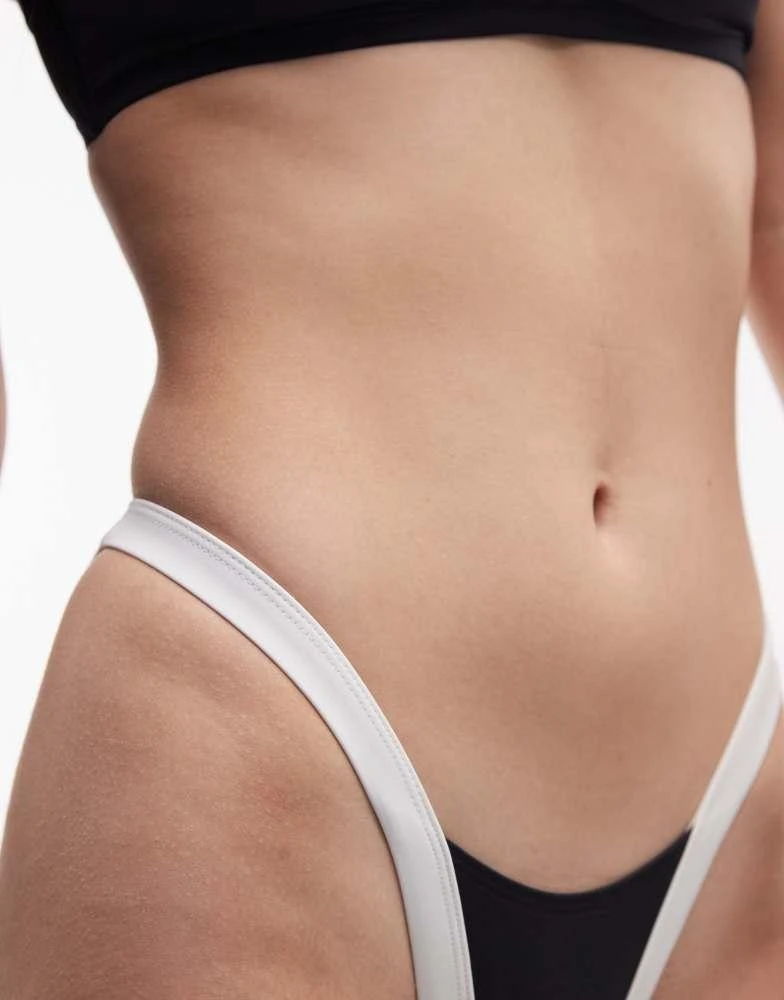 ASOS ASOS DESIGN Fuller Bust exclusive Cordelia contrast high leg bikini bottom in black and white 3