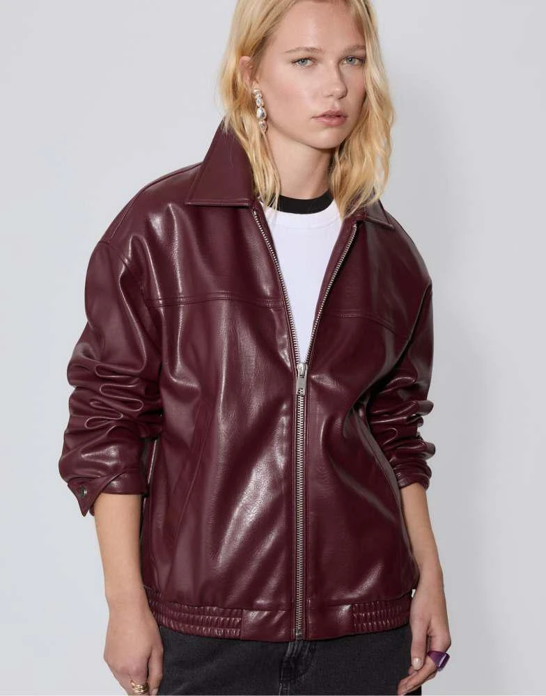 Shop Stradivarius Oversize faux leather jacket in burgundy on Sale