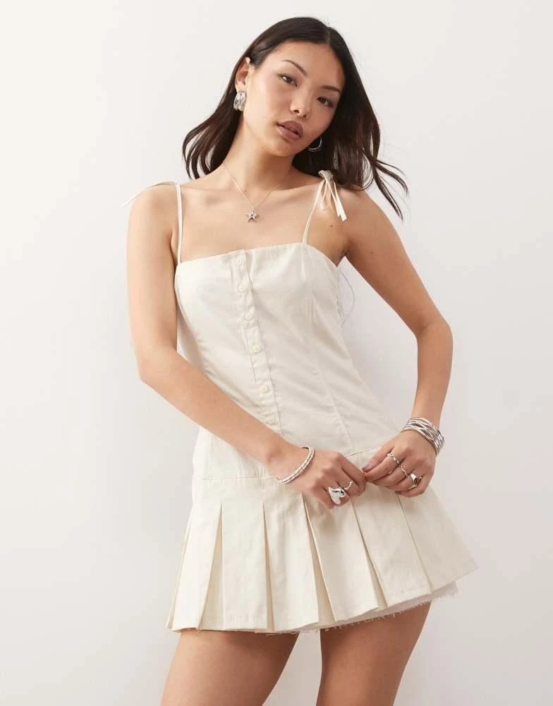 Monki cotton drop waist mini dress with pleated skirt in white  On Sale  Now with Up to 65% Off | Discover Exclusive Deals & Savings at BeyondStyle   Authentic Monki Home|women