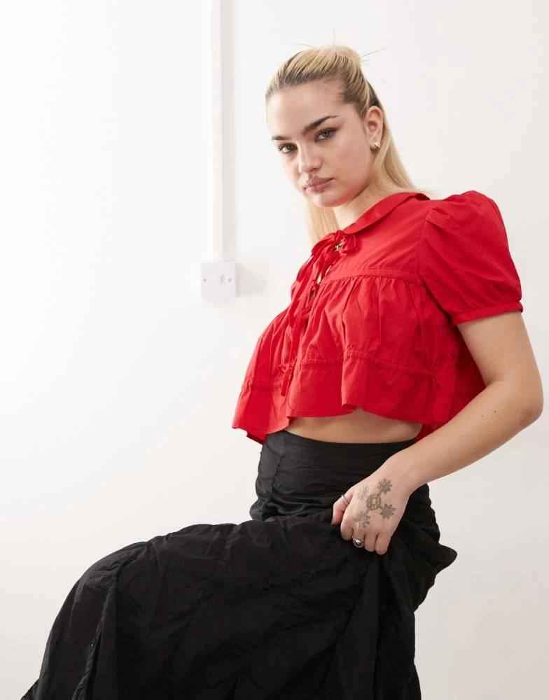 Monki Monki cotton poplin peplum tie shirt top with collar and front tie up detail in red 1