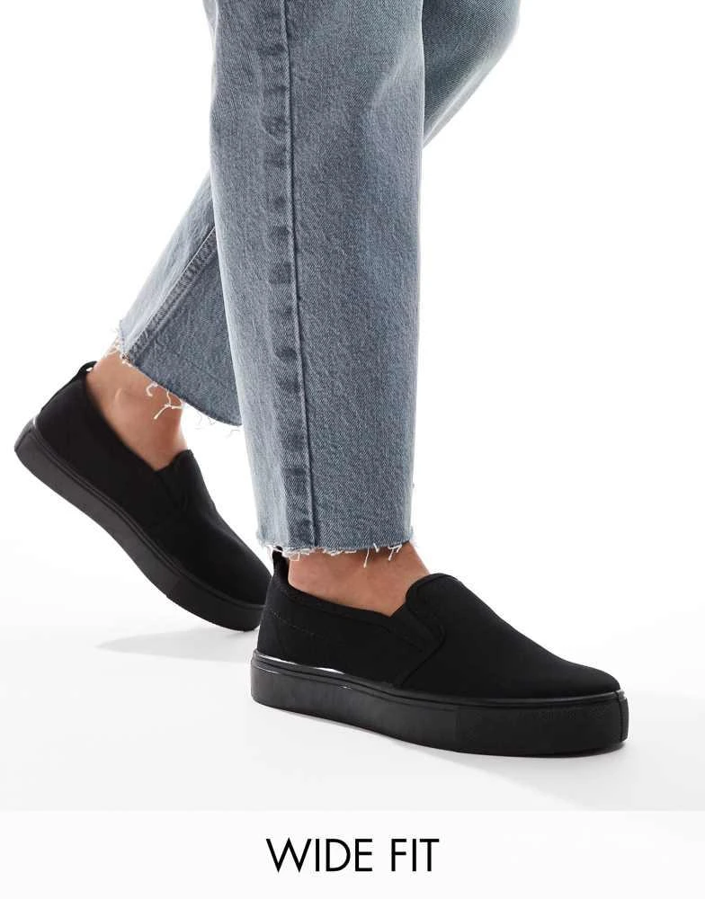 ASOS ASOS DESIGN Wide Fit Dotty slip on plimsolls in black 1