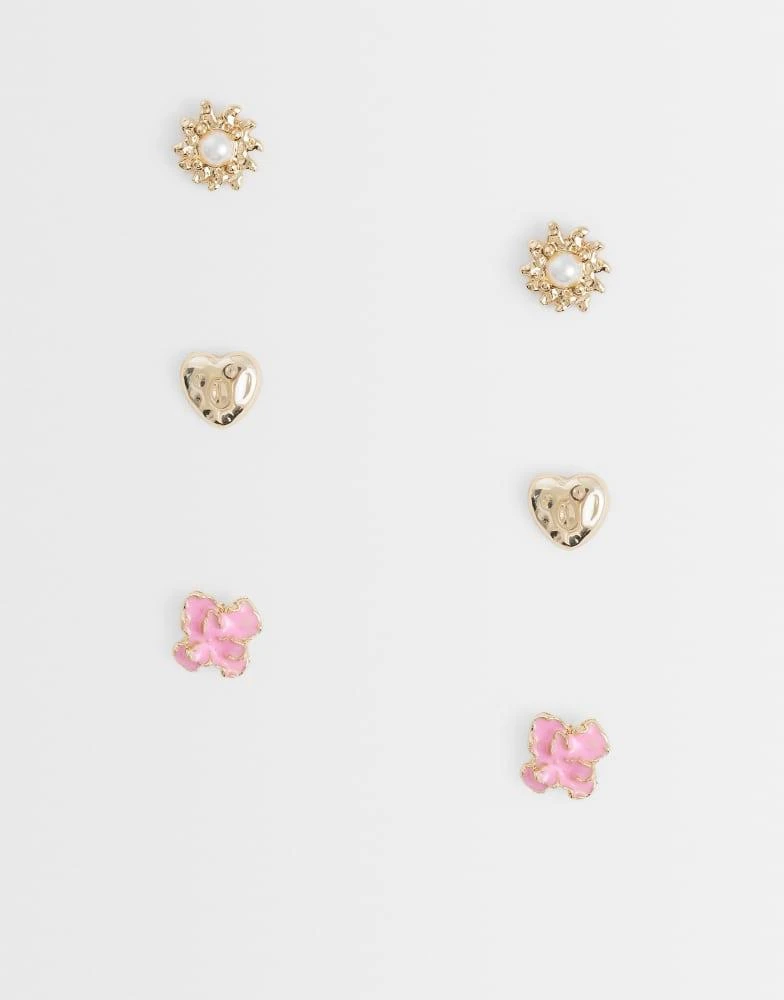 ASOS ASOS DESIGN pack of 3 studs with mixed sun, heart and flowers in pink and gold tone