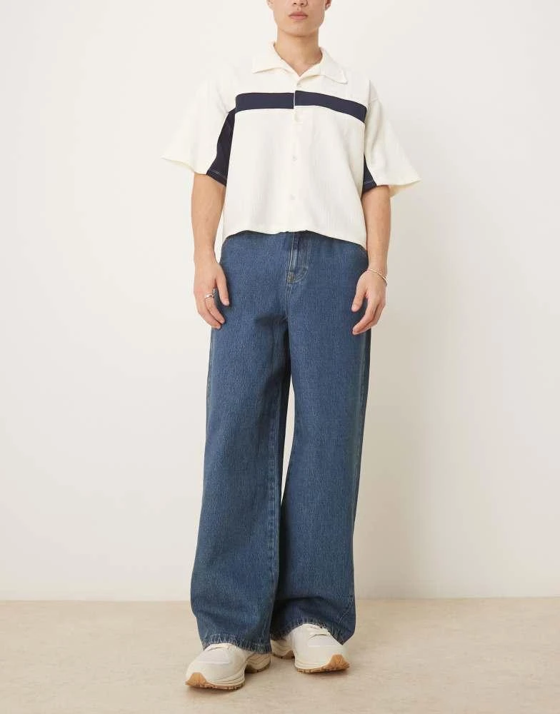 ASOS ASOS DESIGN super baggy jeans with twisted seams in mid wash blue 1