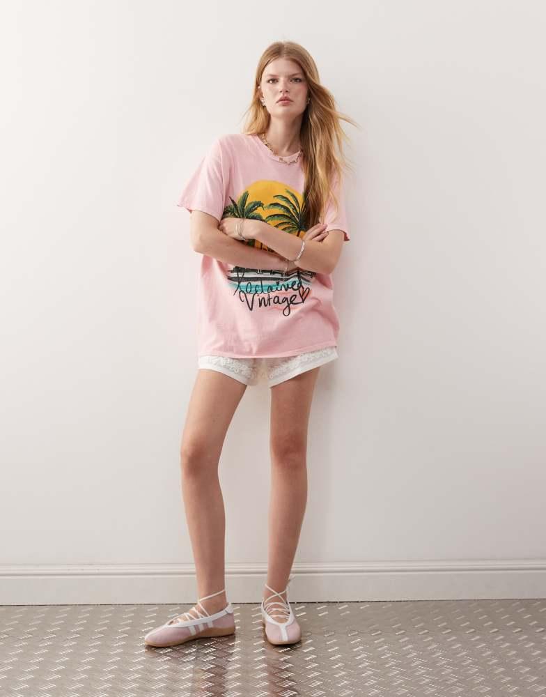 Reclaimed Vintage Reclaimed Vintage oversized t-shirt with palm tree holiday print in pink