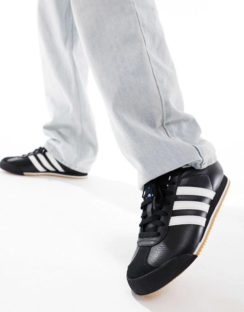 Shop adidas Originals Kick trainers in black and white on Sale at