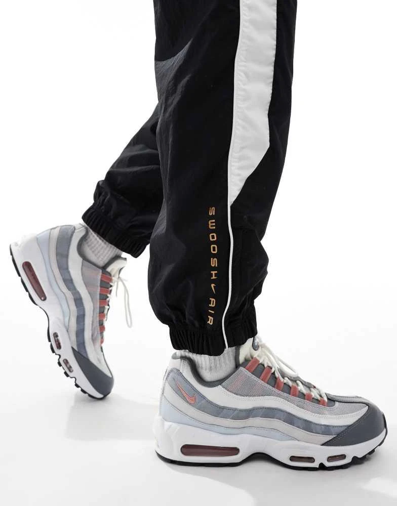 NIKE Nike Swoosh Air woven joggers in black and white 3