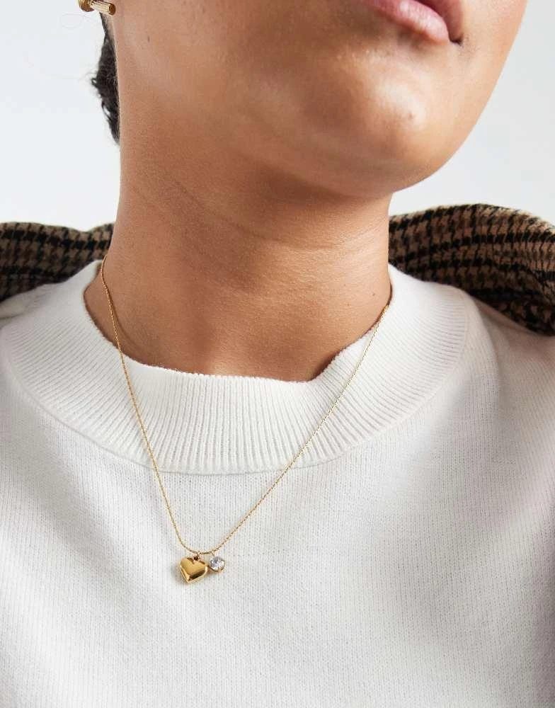ASOS ASOS DESIGN Curve stainless steel necklace with cz sparkly crystal and heart pendant in gold tone