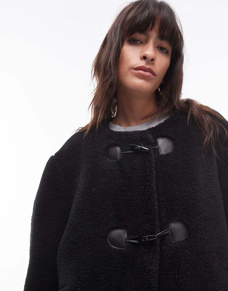 Topshop Topshop toggle short collarless borg coat in black 4