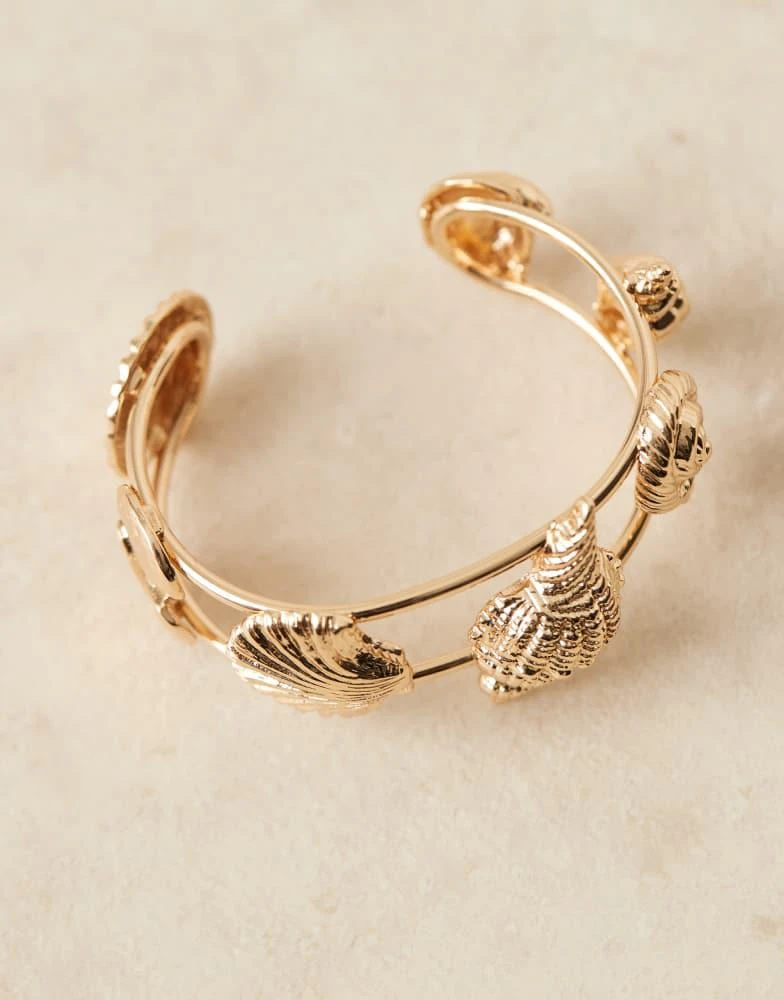 ASOS ASOS DESIGN cuff bracelet in mixed shell design in gold tone 3