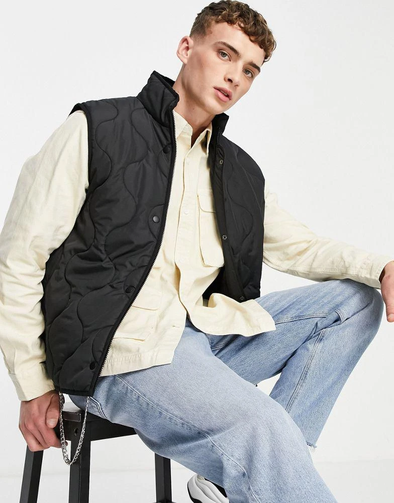 ASOS ASOS DESIGN quilted gilet in black 1