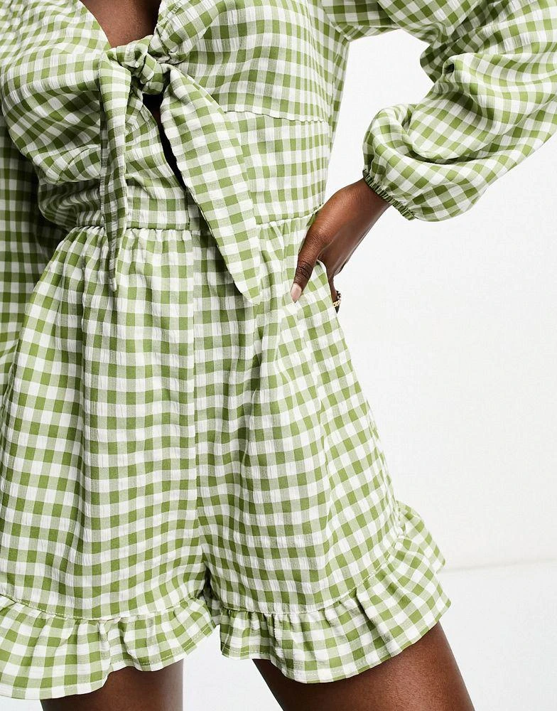 Miss Selfridge Miss Selfridge long sleeve tie front playsuit in khaki gingham 4