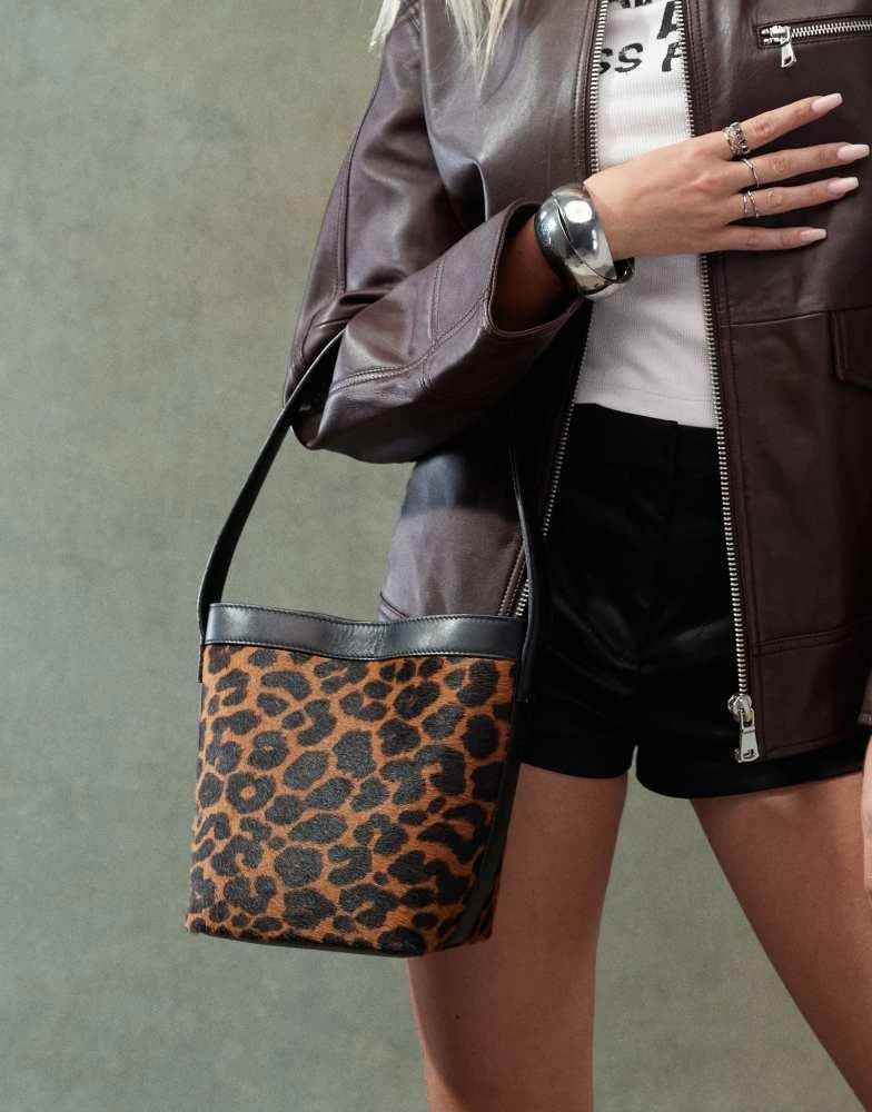 ASOS ASOS DESIGN premium faux leather leopard bucket shoulder bag in brown 1
