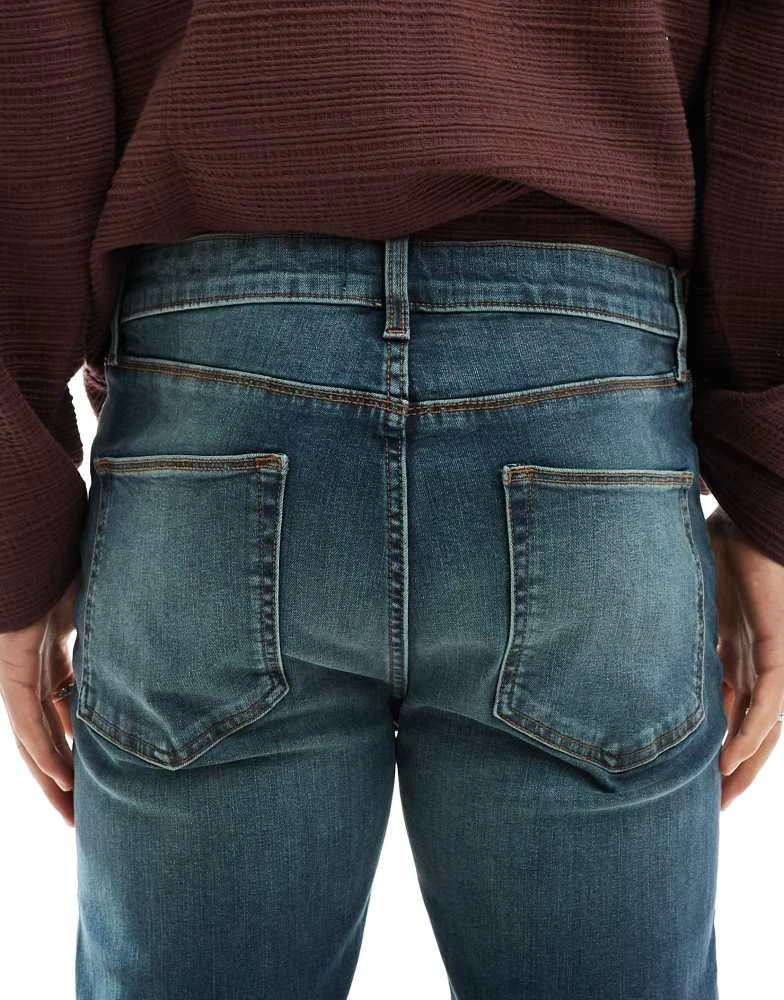 ASOS ASOS DESIGN stretch flare jeans in mid blue with green tint 4