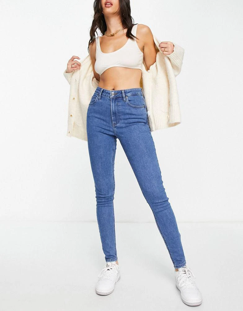 ASOS ASOS DESIGN skinny jeans in mid blue 4