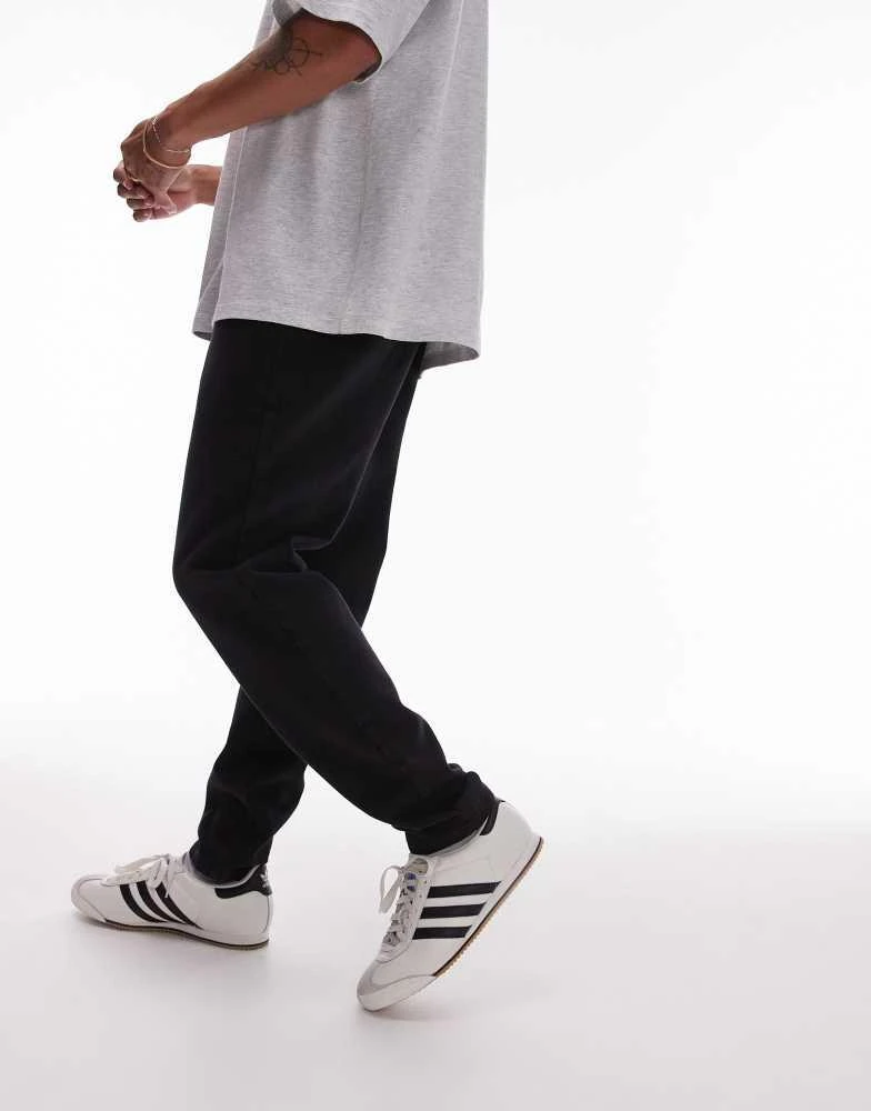 Topman Topman tapered trousers with elasticated waistband in black 1