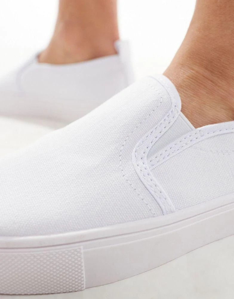 ASOS ASOS DESIGN Dotty slip on plimsolls in white 2